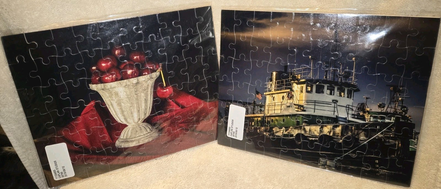 2 CAPLAN STUDIOS 60 PIECE PUZZLES 1) CHEERIES IN A PLANTER 2) DONNY S TUG BOAT
