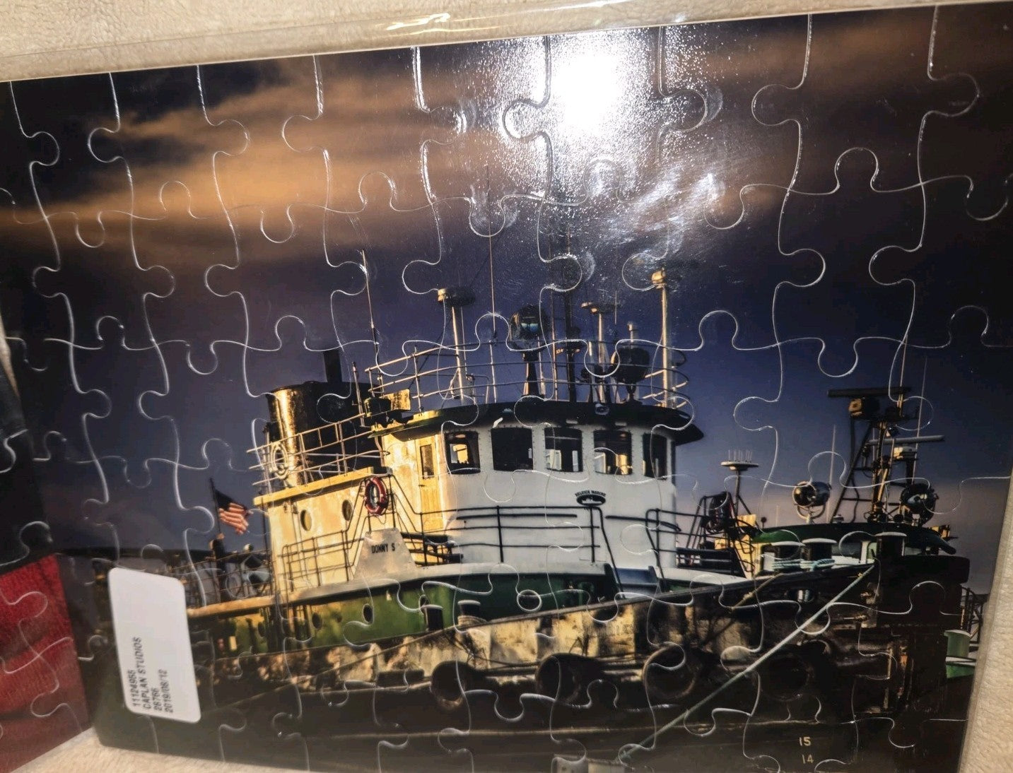 2 CAPLAN STUDIOS 60 PIECE PUZZLES 1) CHEERIES IN A PLANTER 2) DONNY S TUG BOAT